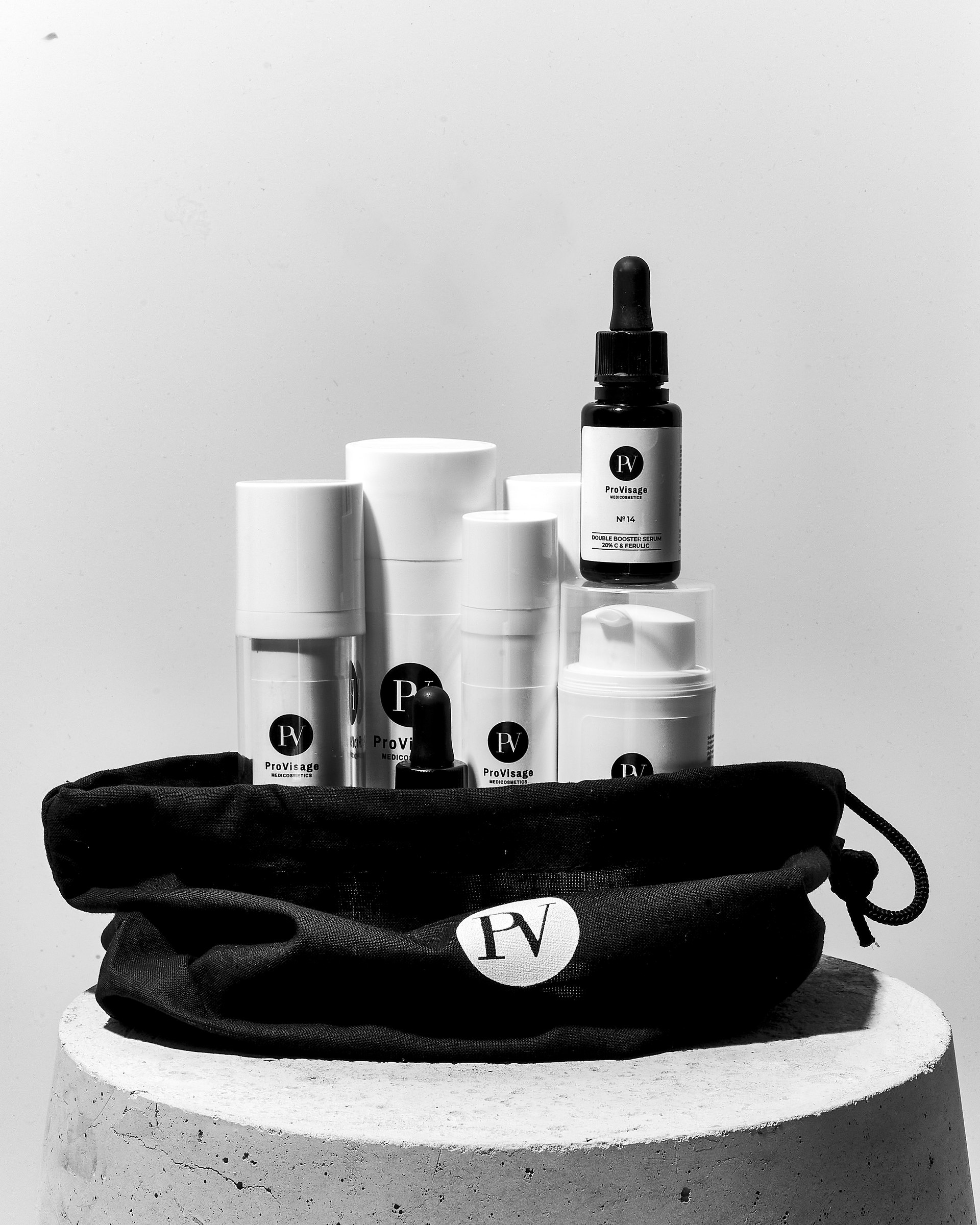 Skincare product lineup on a pouch