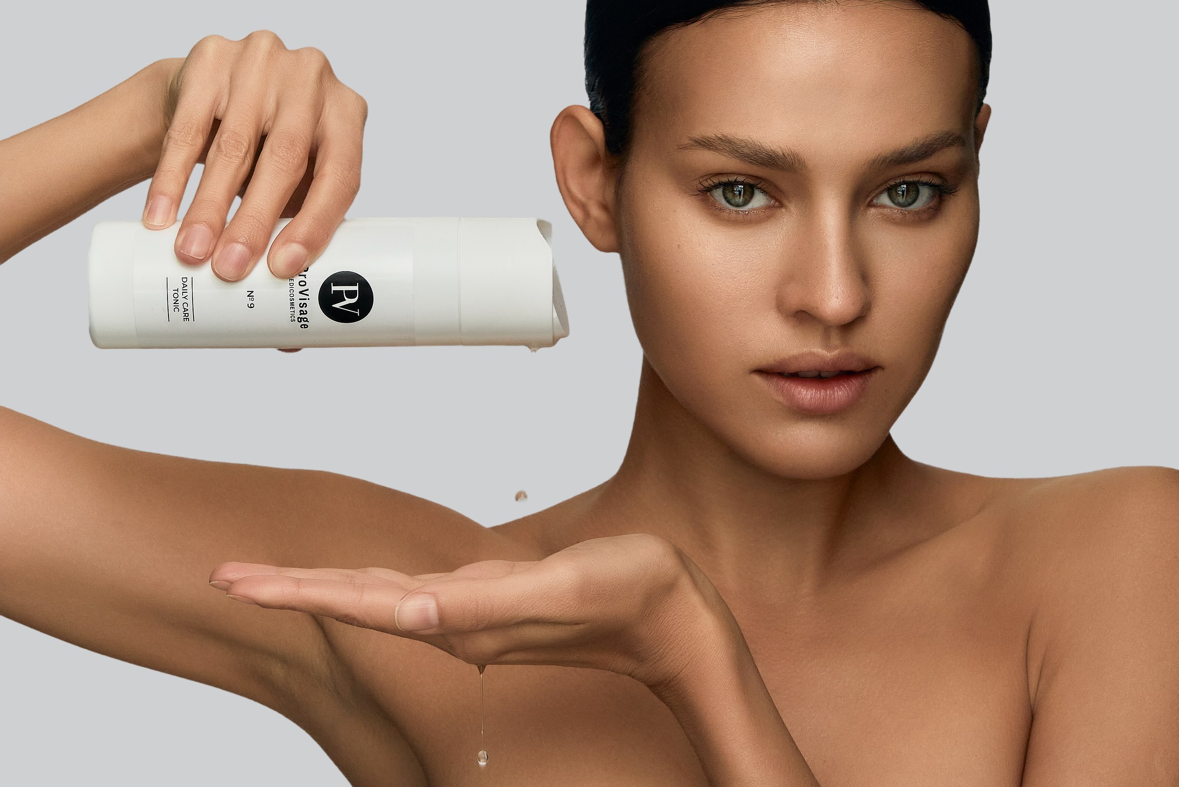 Skincare product, pouring tonic into hand, model portrait