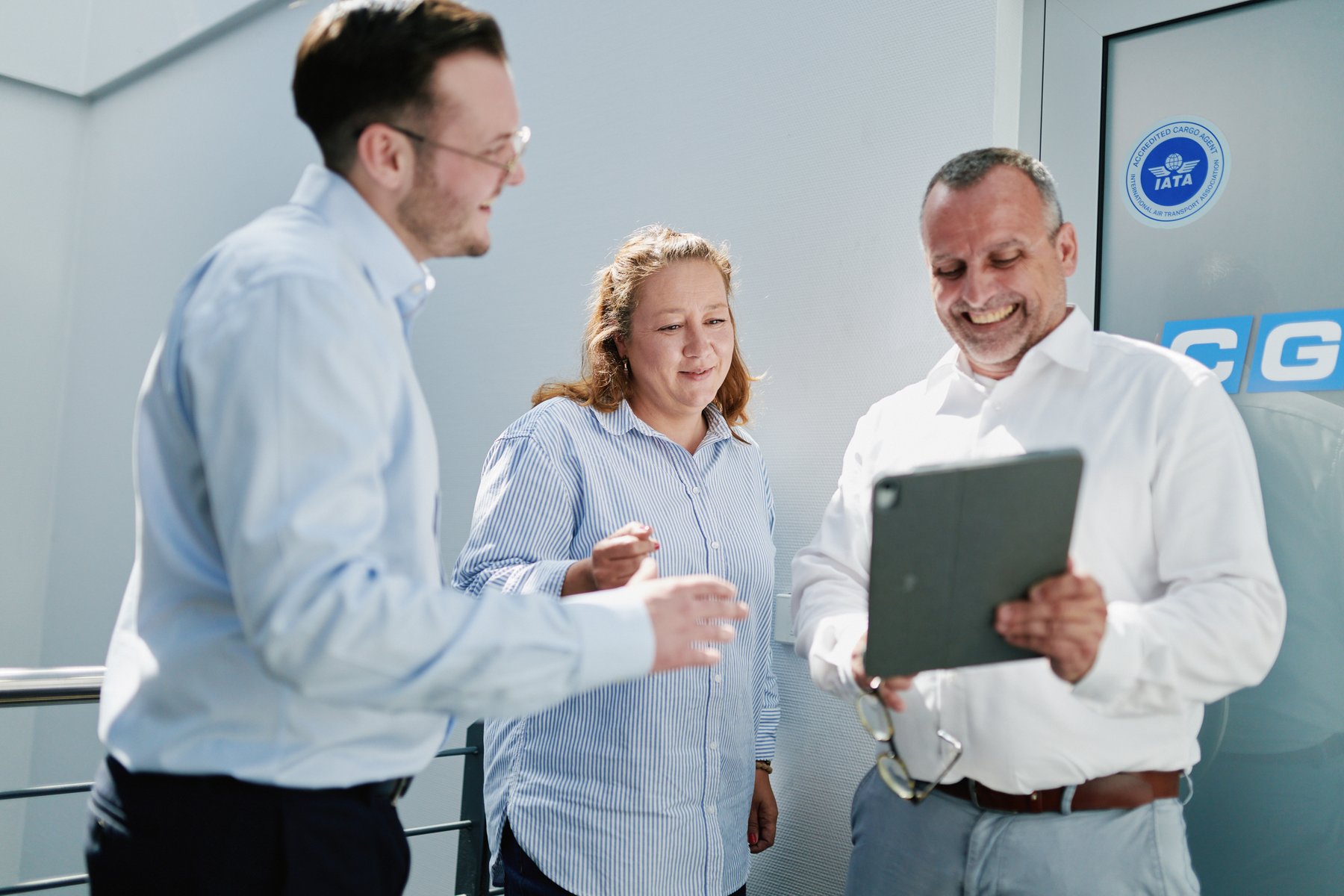 Team discussing on tablet