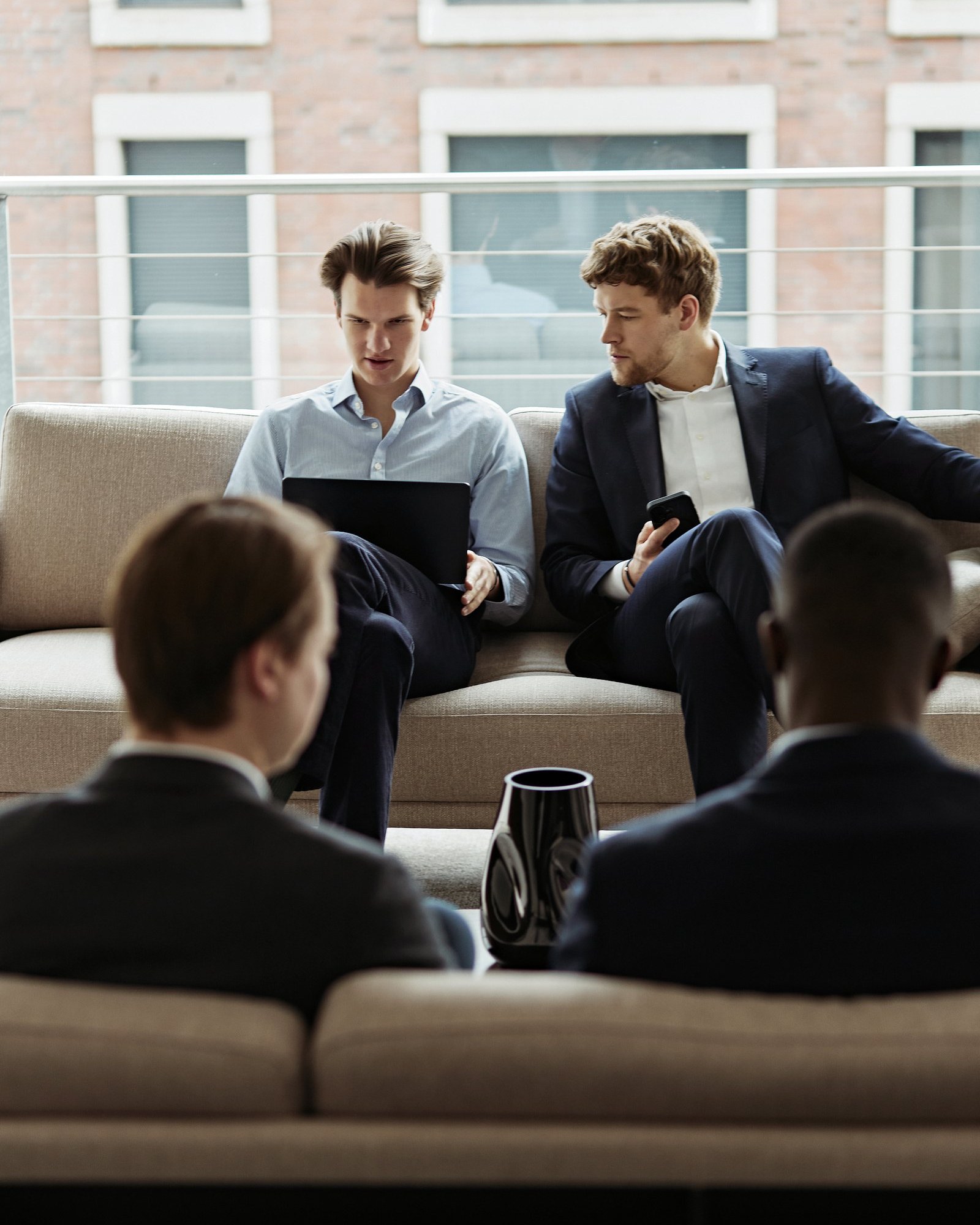 Colleagues discussing on a couch