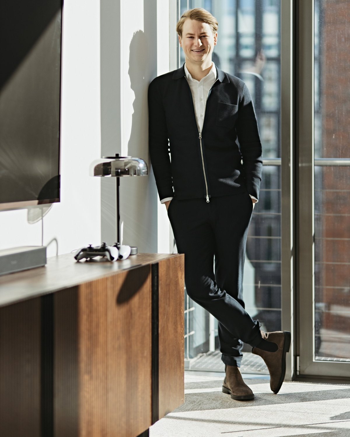 Office portrait, by the window, lounge area