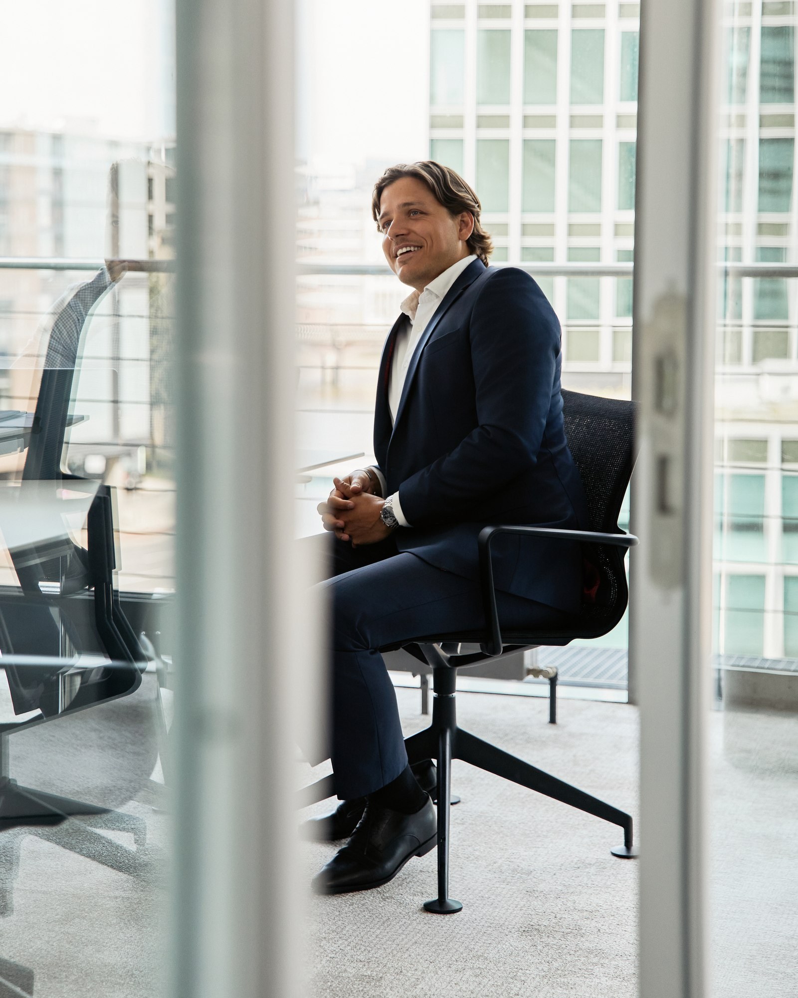 Executive portrait, office window