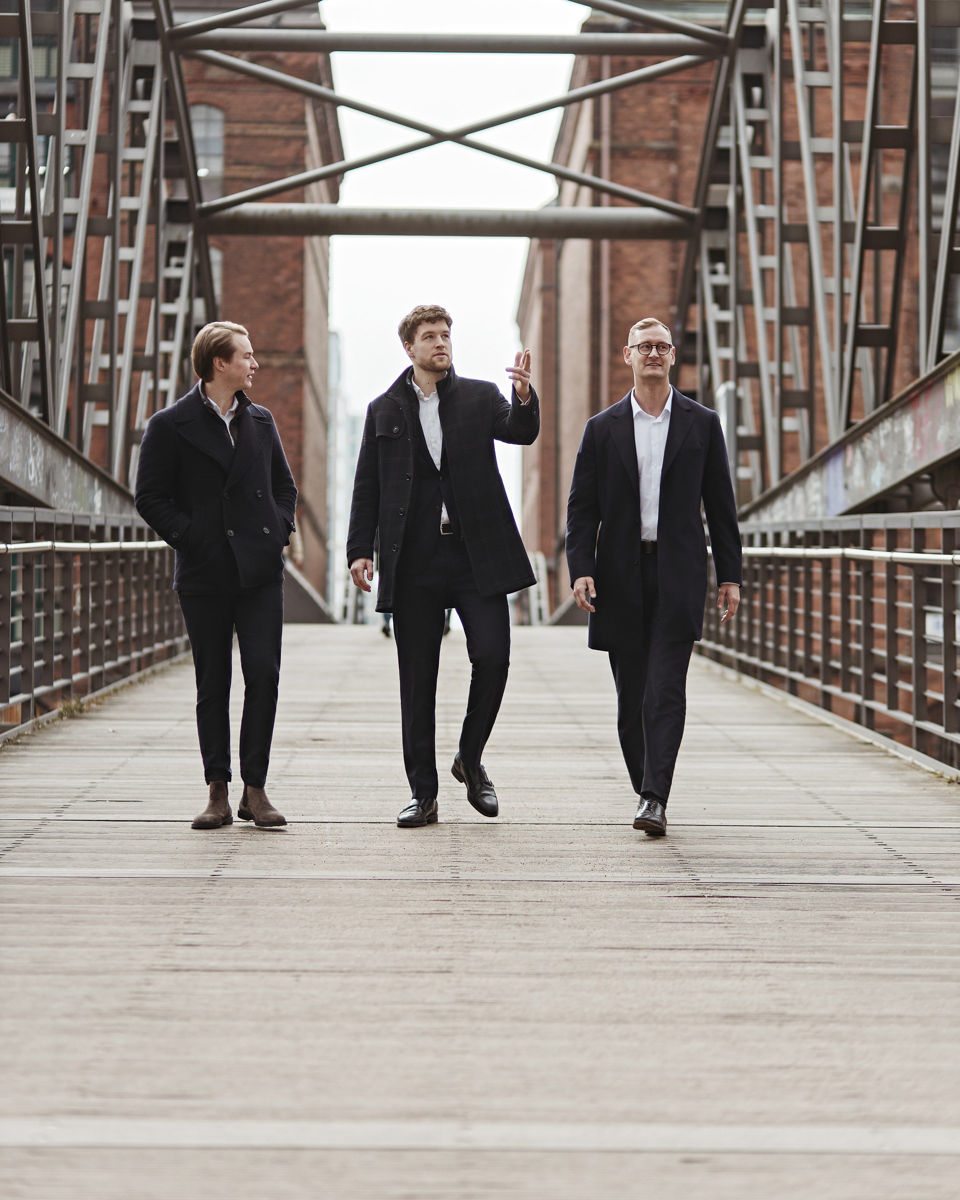 Team portrait, walking on a bridge