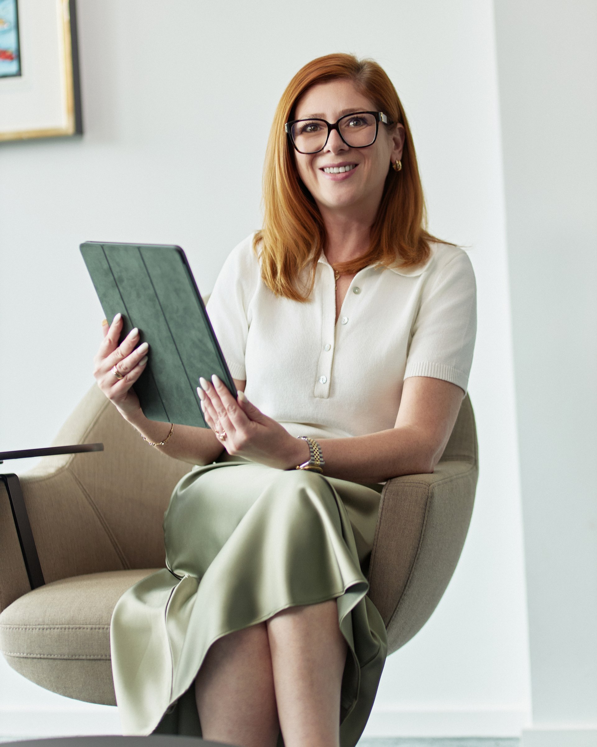 Office portrait, seated with a tablet