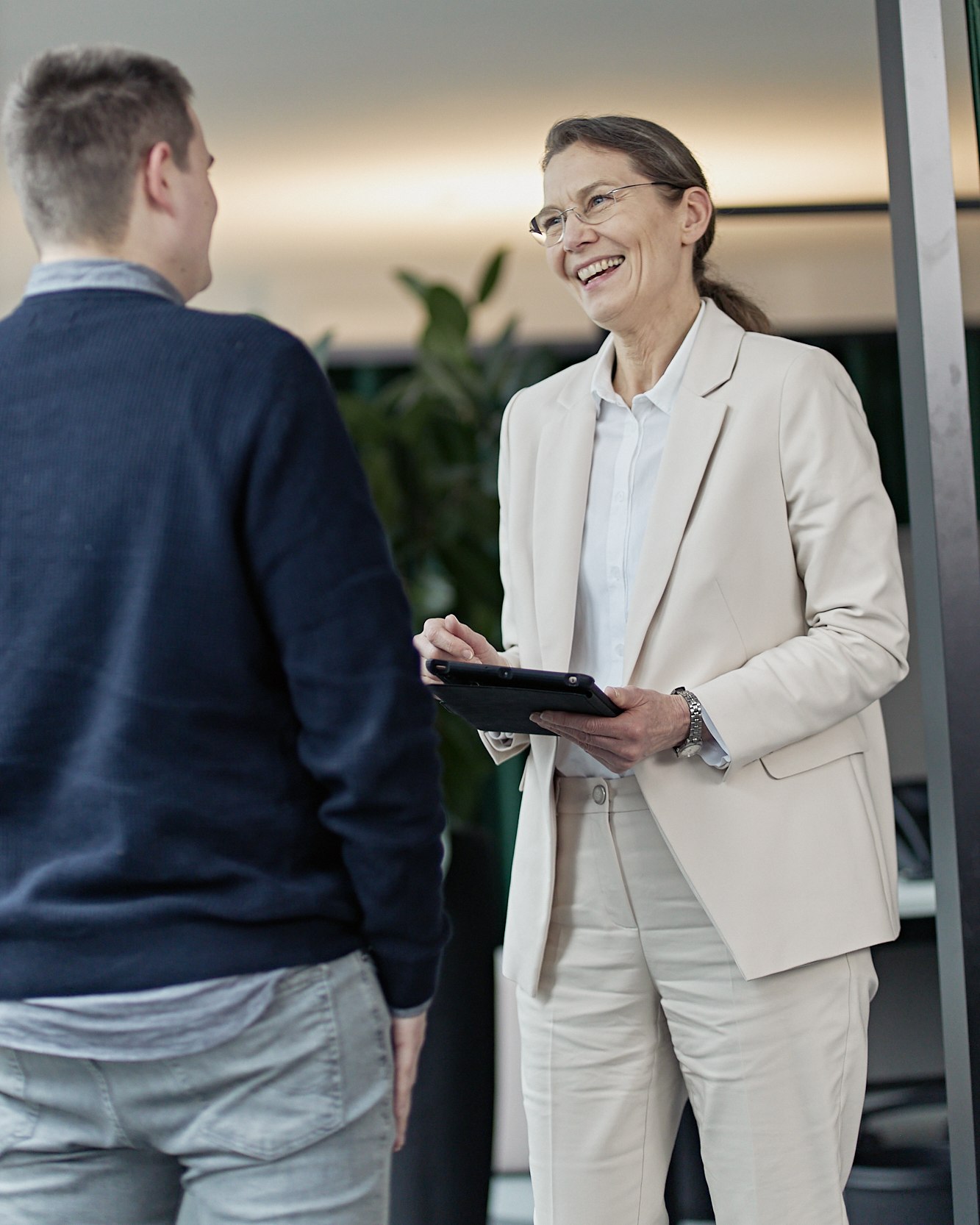 Office consultation, discussing on a tablet