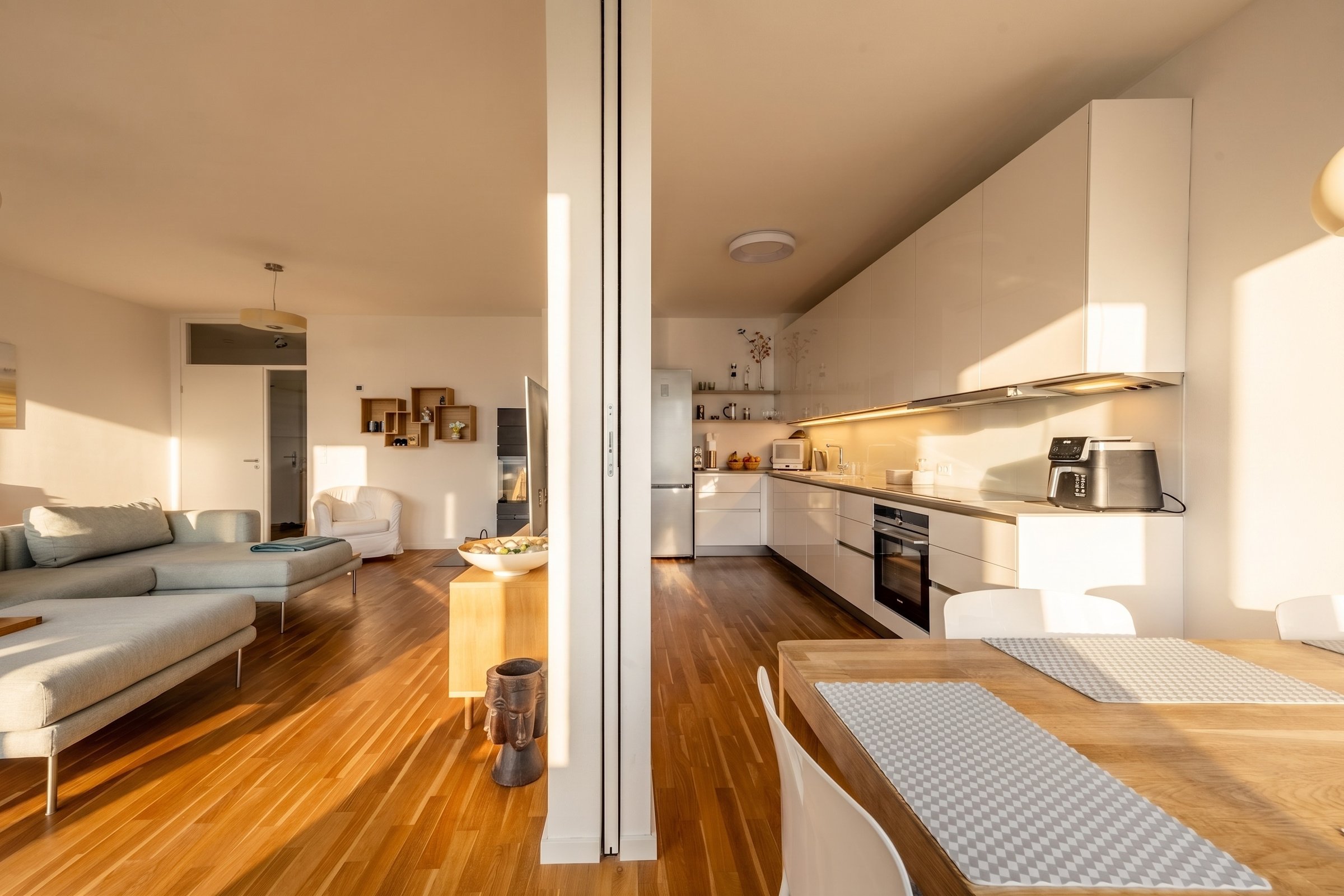 Sunlit apartment, kitchen and living room divide