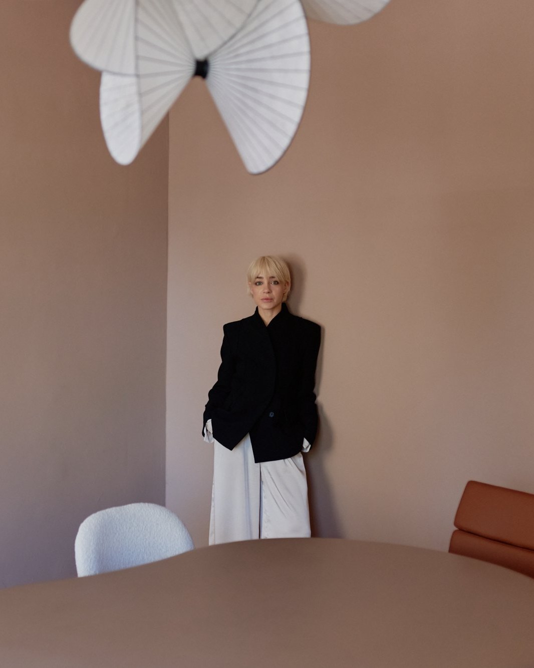 Signature portrait, standing against wall