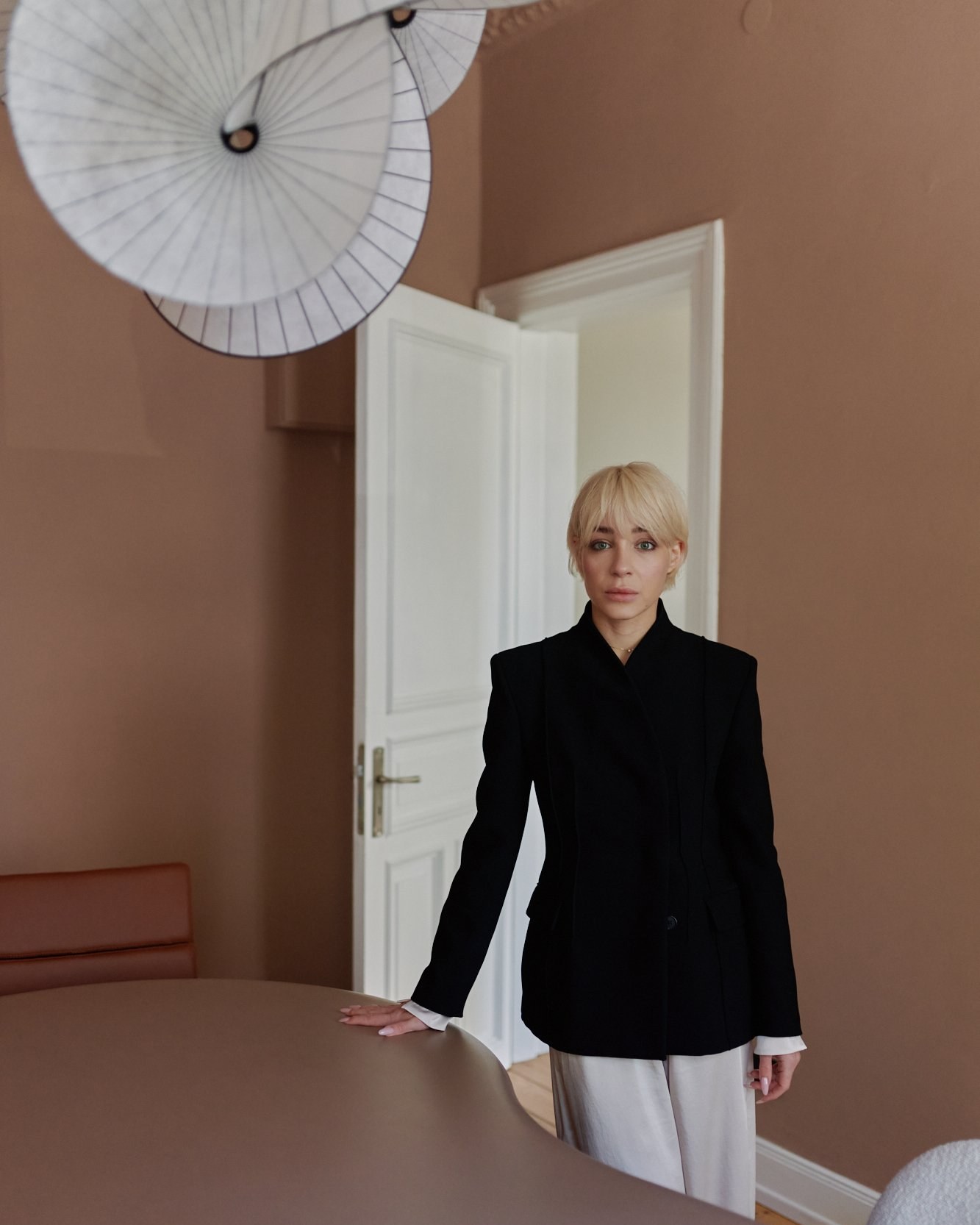 Signature portrait, near table, paper light fixture