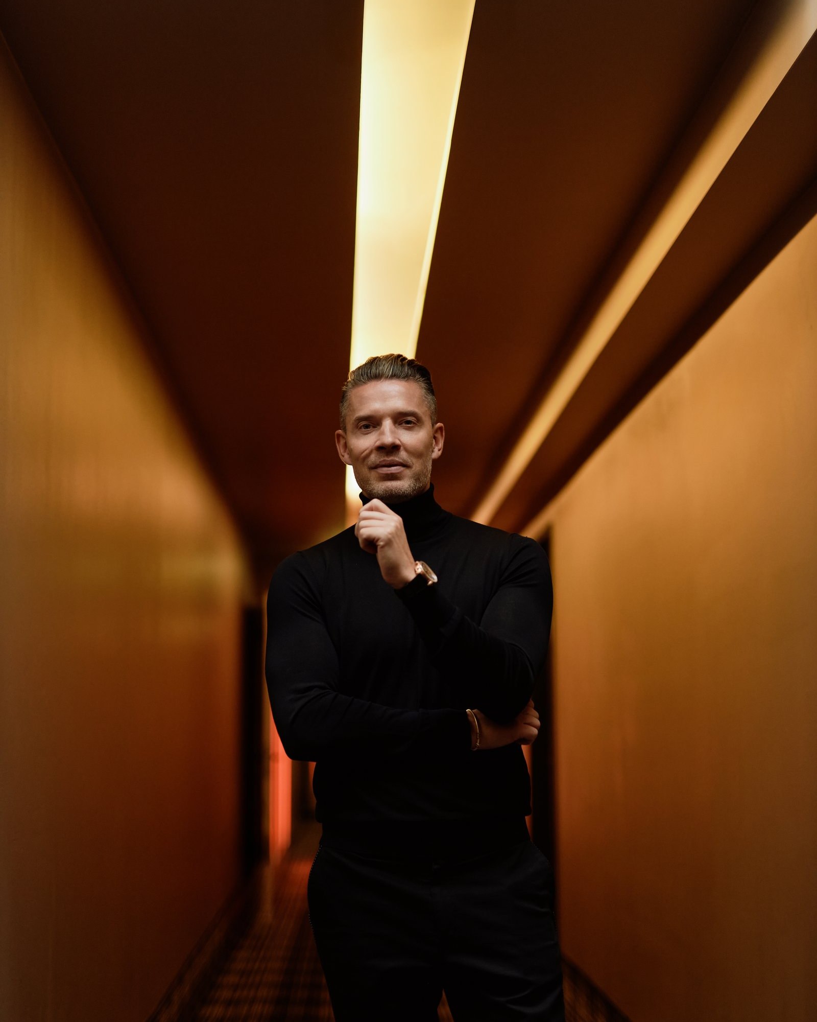 Signature portrait, hotel corridor, gold light