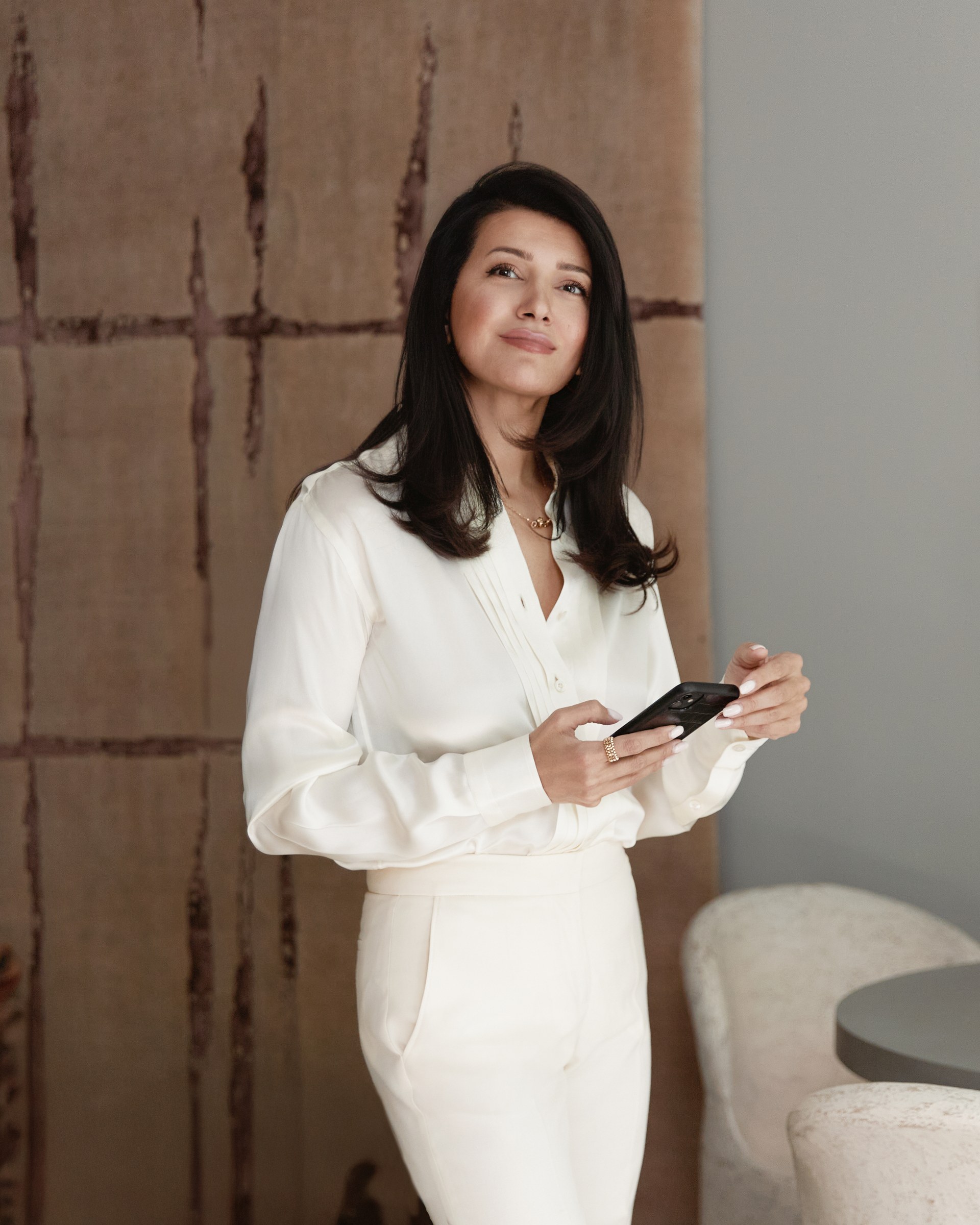 Signature portrait, holding phone, textile backdrop