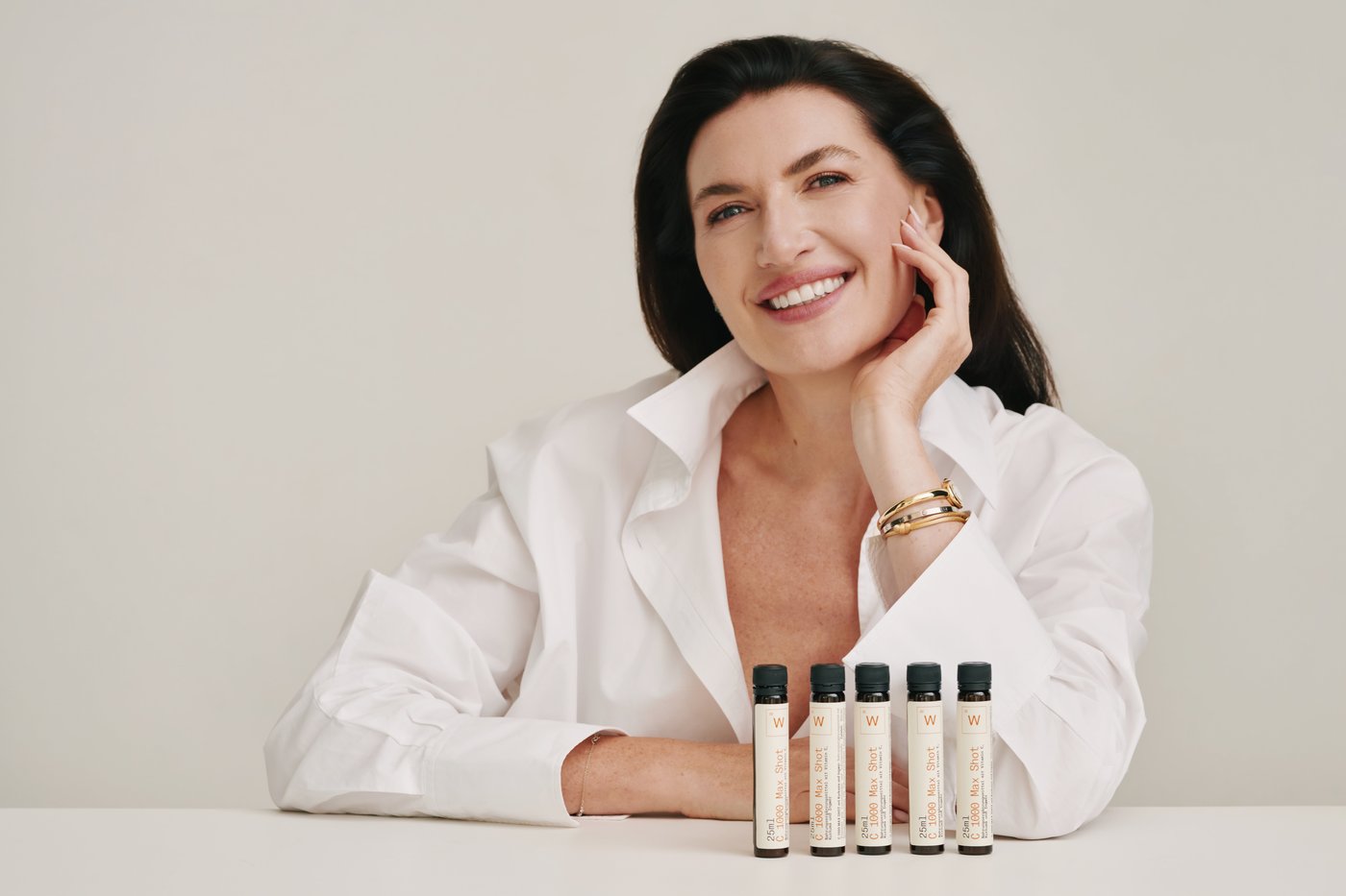Studio portrait, close-up, product in hand