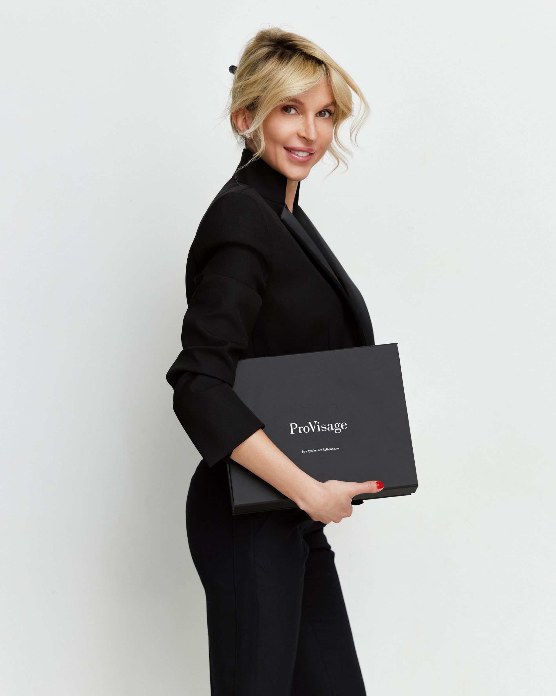 Studio portrait, walking, black suit