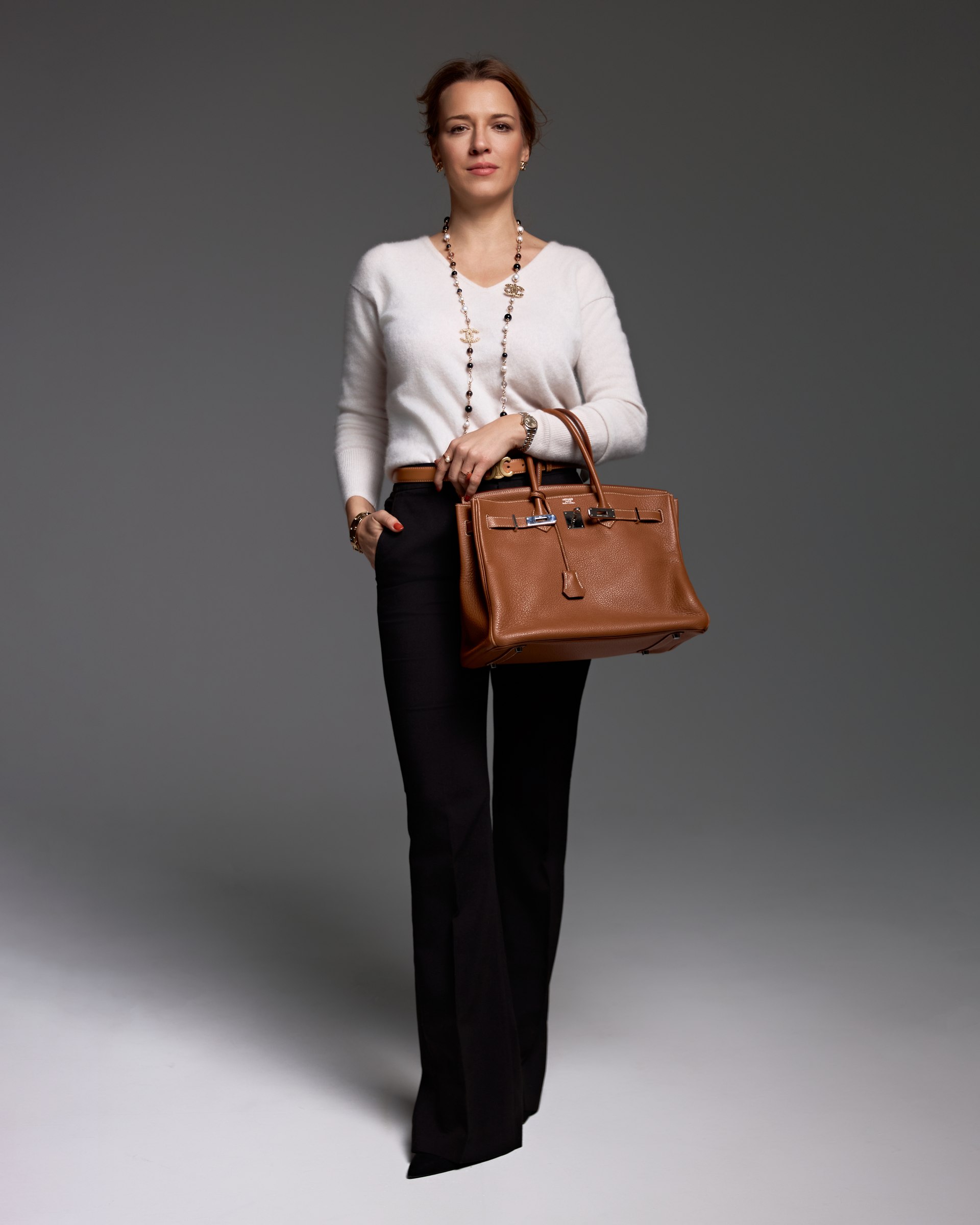 Studio portrait, full length, handbag