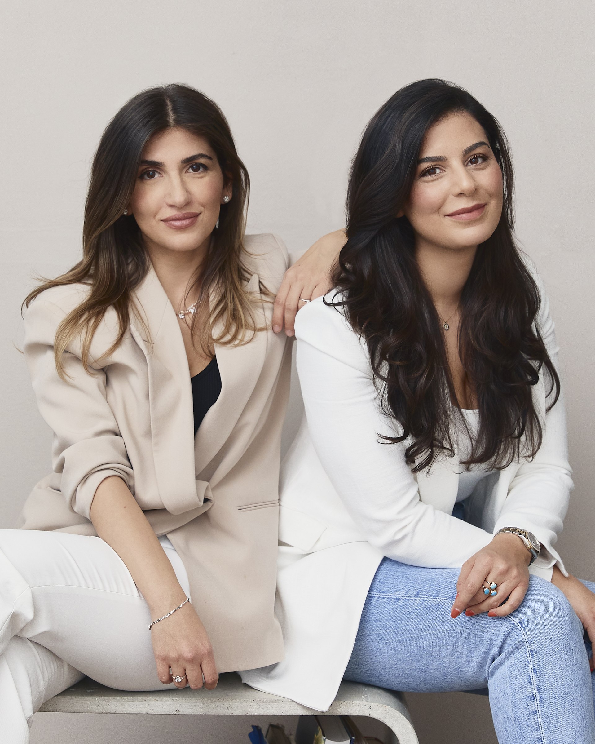 Studio portrait, two women, seated
